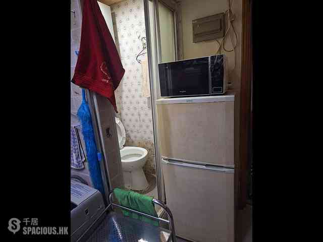 Sham Shui Po - Man On Building 05